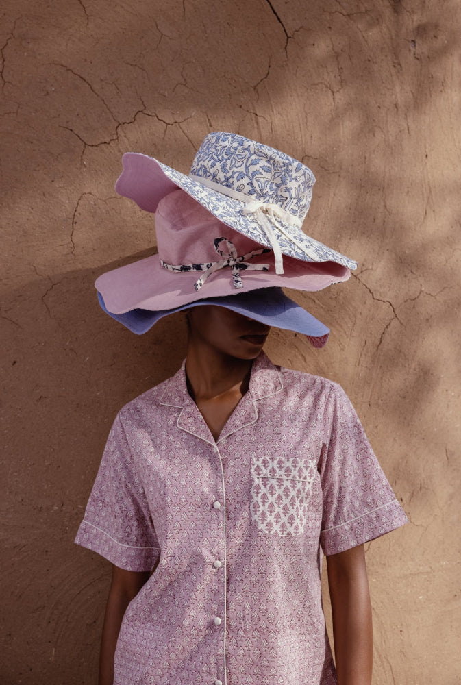 Model wearing hats and Booti Lilac Vanilla Cotton Pyjamas