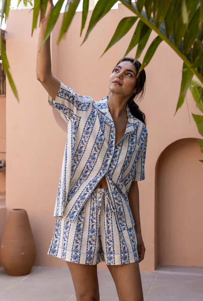 Model looking upwards and wearing Cobalt Ribbon Cotton Pyjamas
