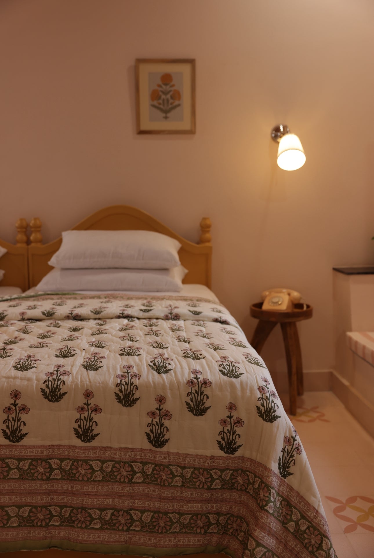 A bedroom showing paxford willow quilt on the bed