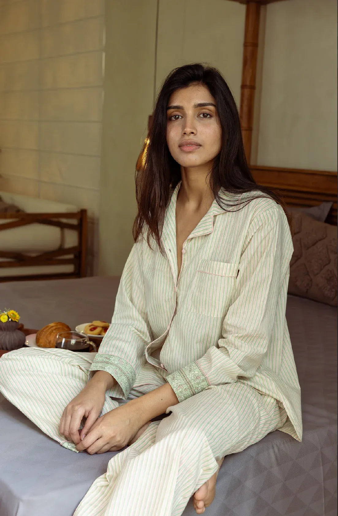 Pink and sage stripe pyjamas lifestyle shot - luxury cotton sleepwear by Mooch Cotswolds