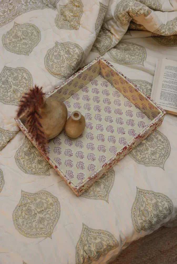 Fabric decorative tray on a kiftsgate stone quilt