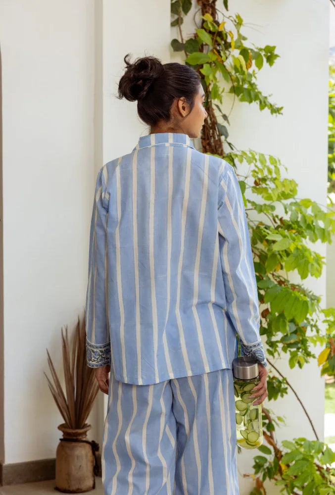 Ocean stripe pyjamas lifestyle shot - luxury cotton sleepwear by Mooch Cotswolds