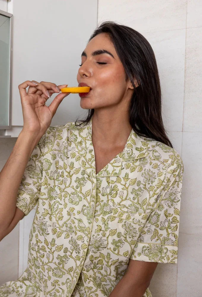 Model eating wearing Westington Sage Cotton Pyjamas