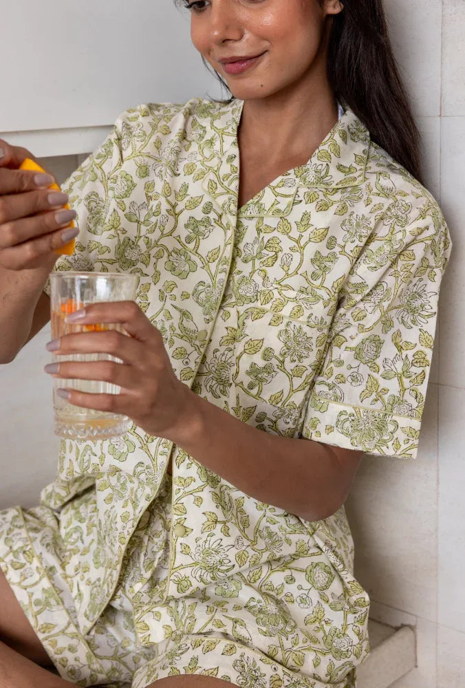 Model with a glass of water wearing Westington Sage Cotton Pyjamas