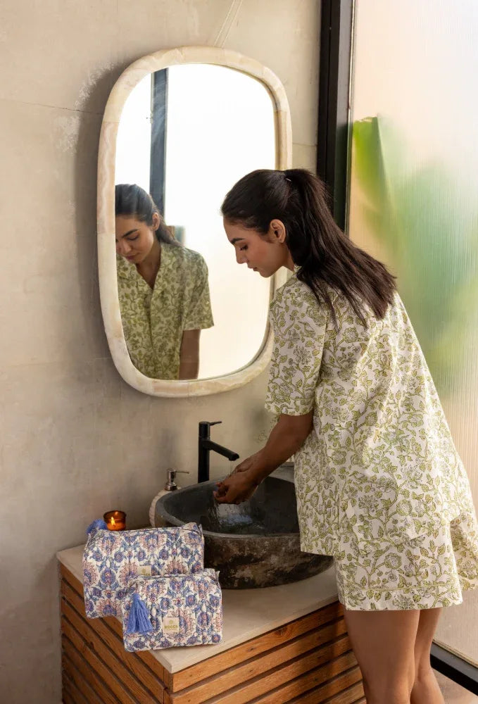 Model washing her hands wearing Westington Sage Cotton Pyjamas
