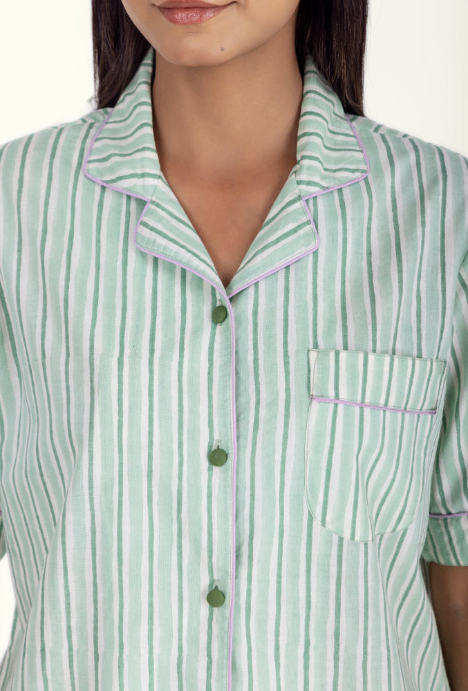 Close-up of model wearing Wilson Stripe Aqua Cotton Pyjama Top