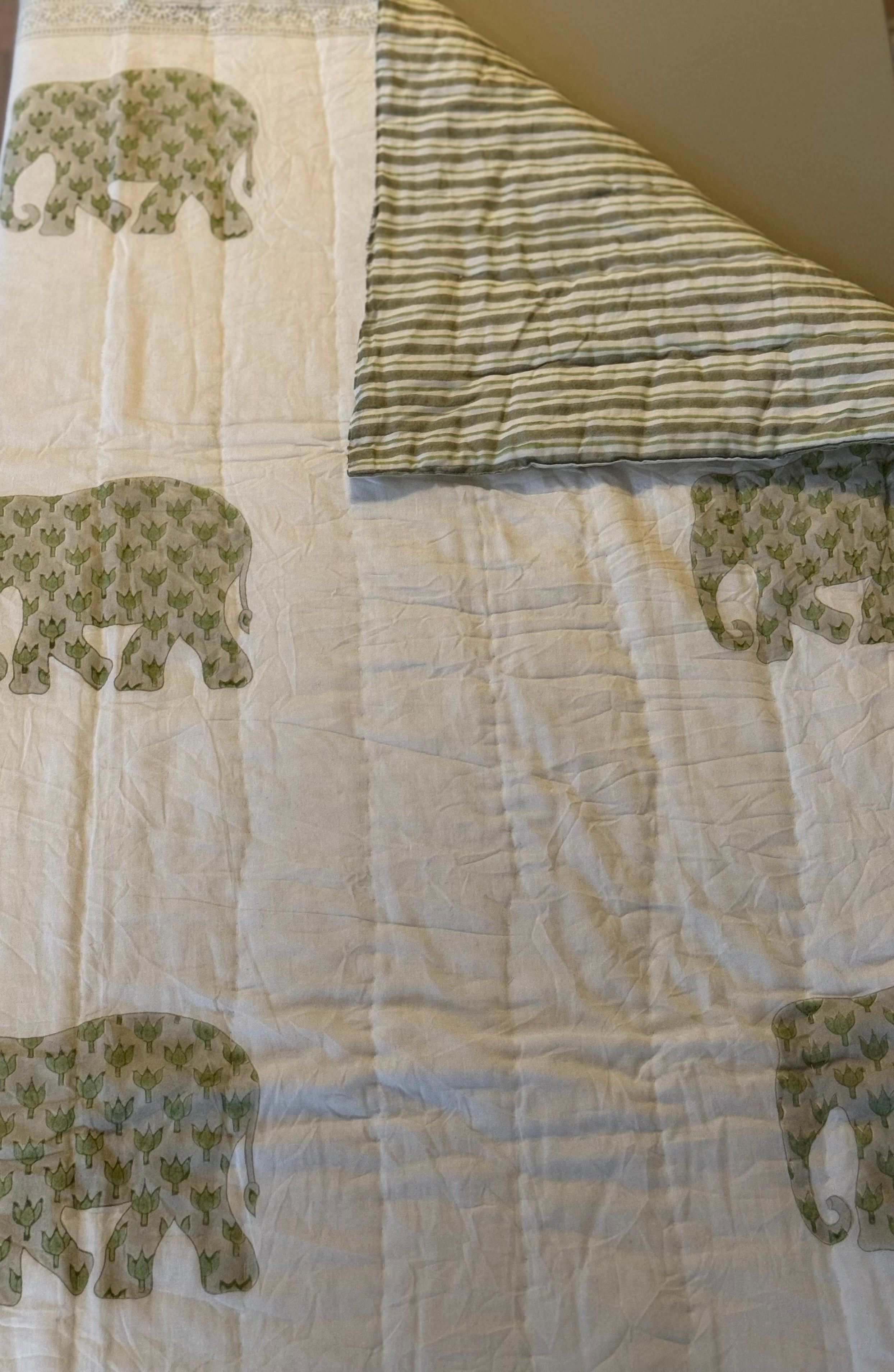 Enzo quilt folded back to shop the reverse