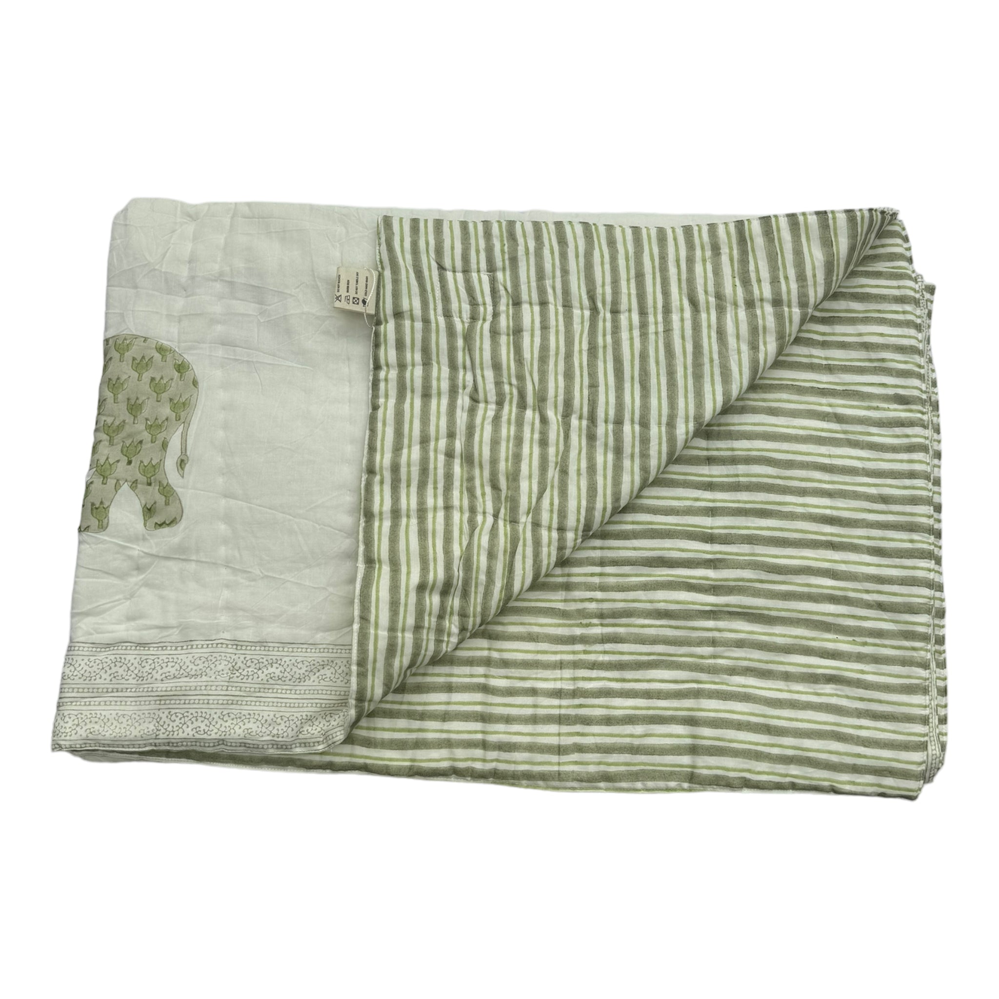 Enzo quilt on white background folded back to see reverse side